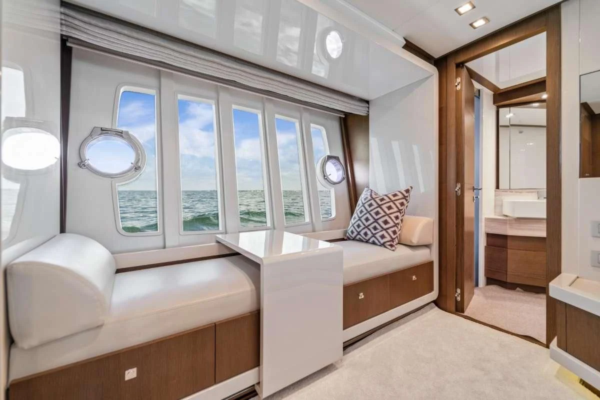 a room with a couch and a mirror aboard HOYA SAXA Yacht for Sale