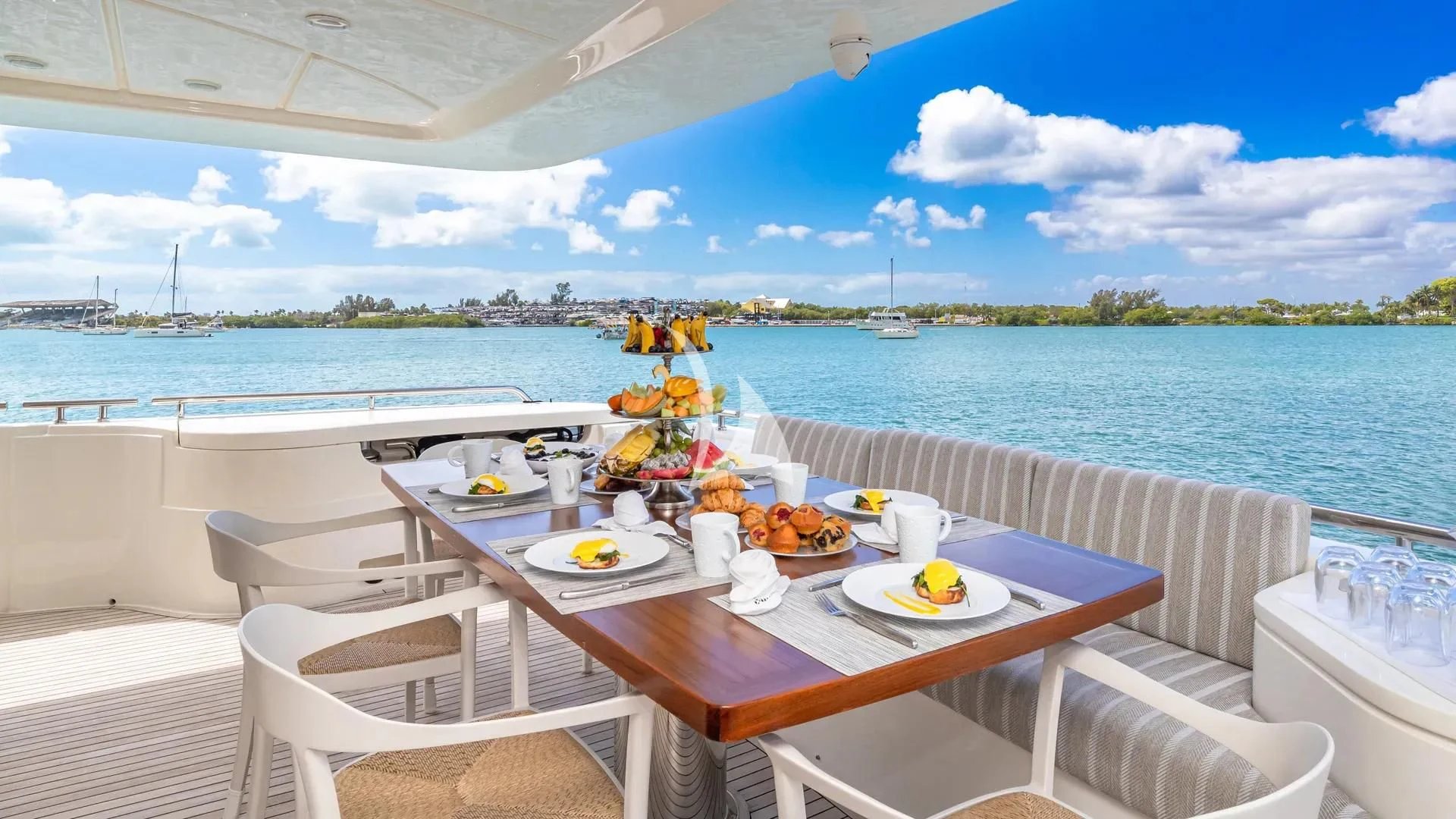 a table with plates and food on it on a boat aboard HOYA SAXA Yacht for Sale