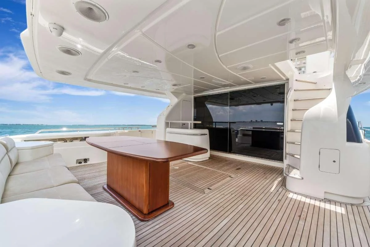 a room with a table and a tv aboard HOYA SAXA Yacht for Sale