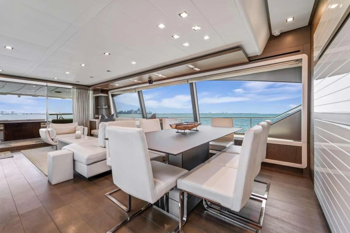 a room with a table chairs and a large window aboard HOYA SAXA Yacht for Sale