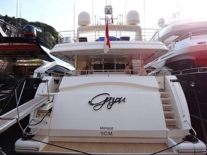 a white boat with black text aboard GAZOU Yacht for Sale