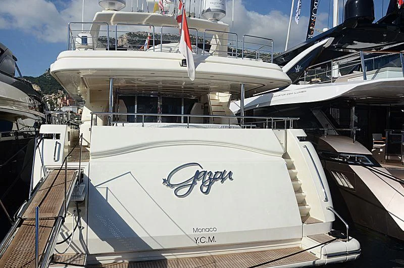 a large white boat with a sign on it aboard GAZOU Yacht for Sale