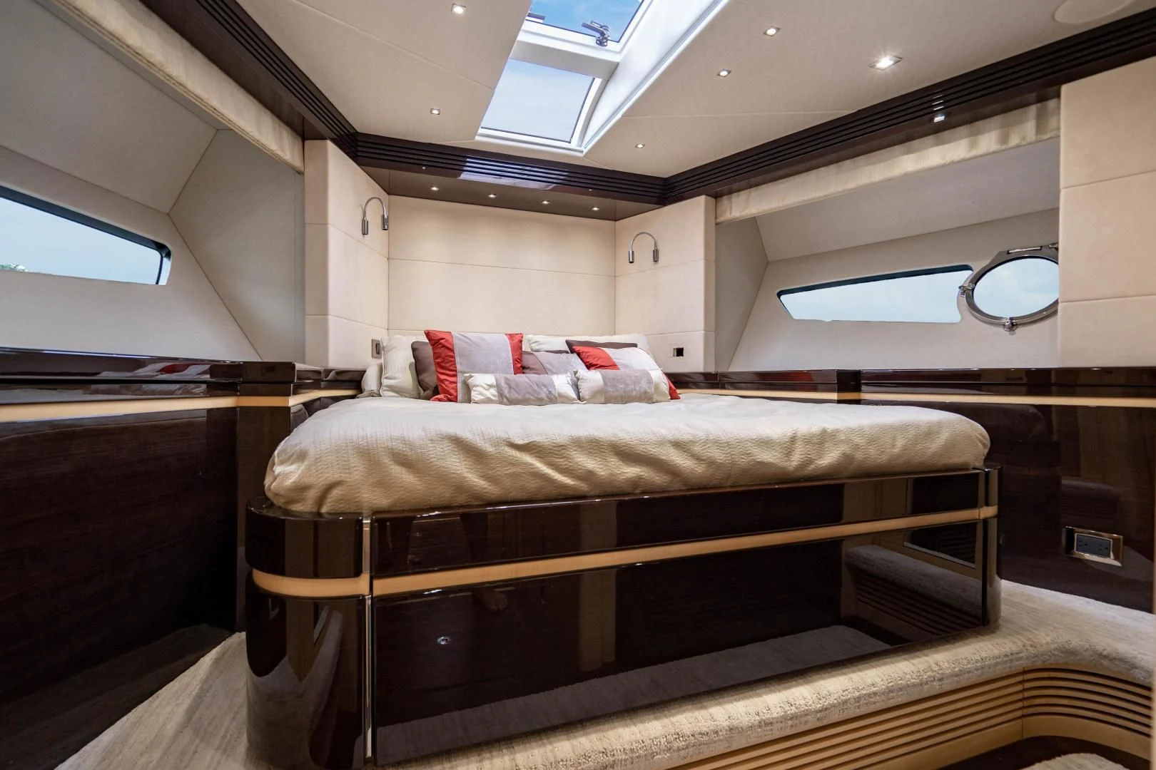 a bed in a room aboard YOLO Yacht for Sale