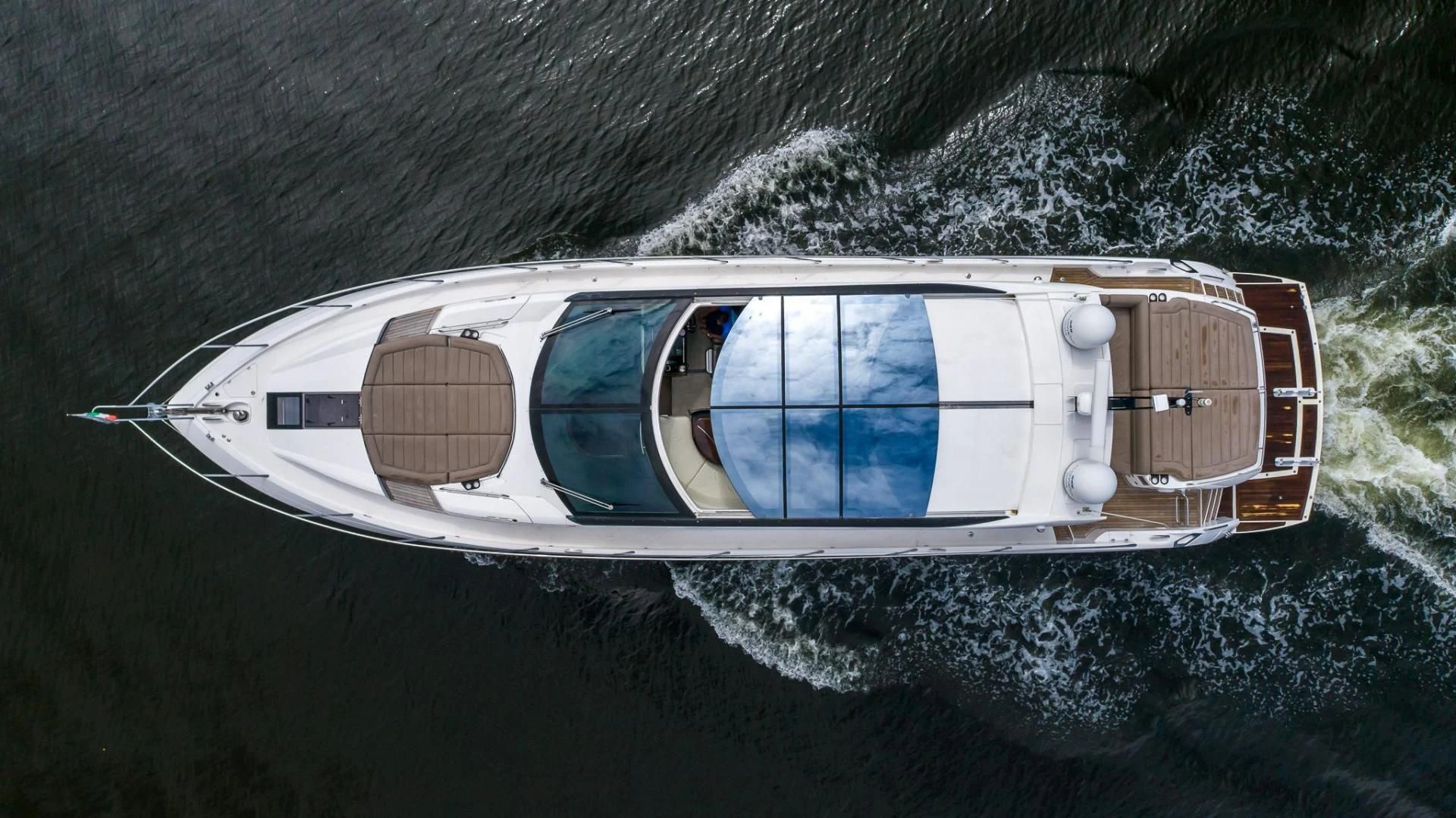a pilot in a plane aboard YOLO Yacht for Sale