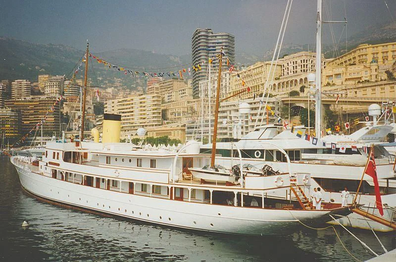 a large white boat in a harbor aboard HAIDA 1929 Yacht for Sale