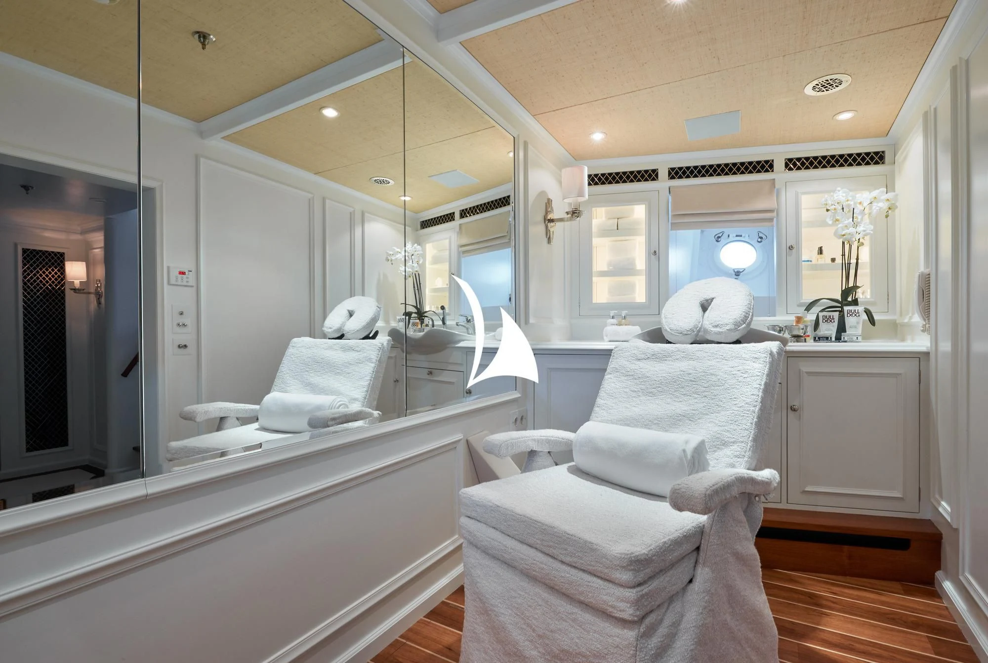 a bathroom with a large mirror aboard HAIDA 1929 Yacht for Sale
