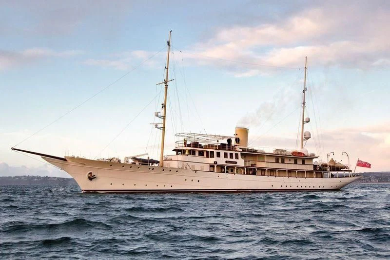 a large white ship in the water aboard HAIDA 1929 Yacht for Sale