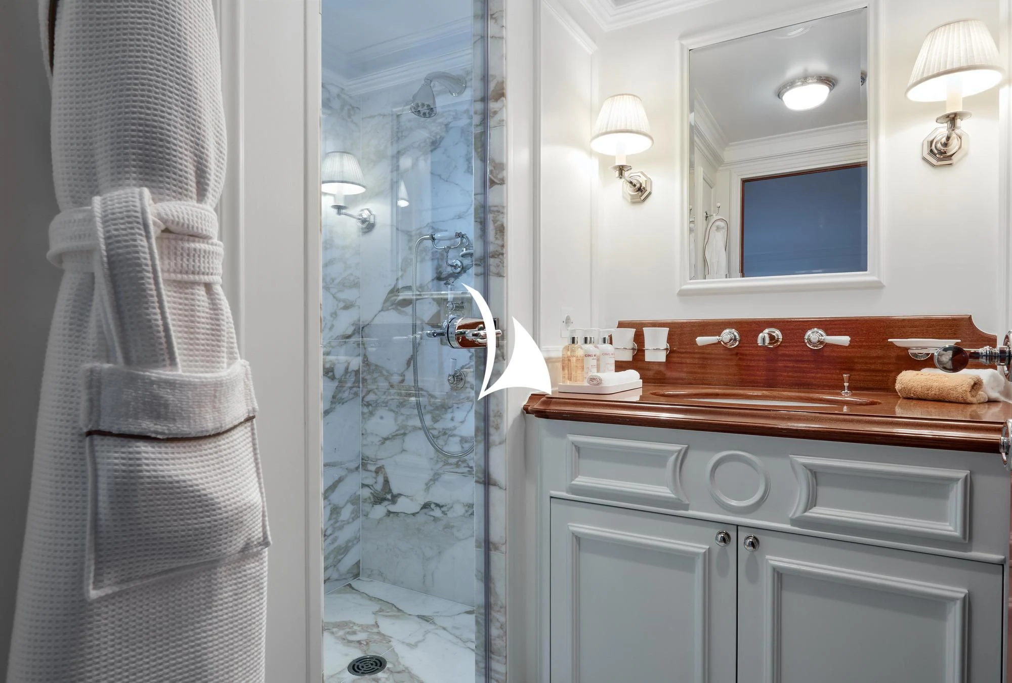 a bathroom with a shower curtain aboard HAIDA 1929 Yacht for Sale