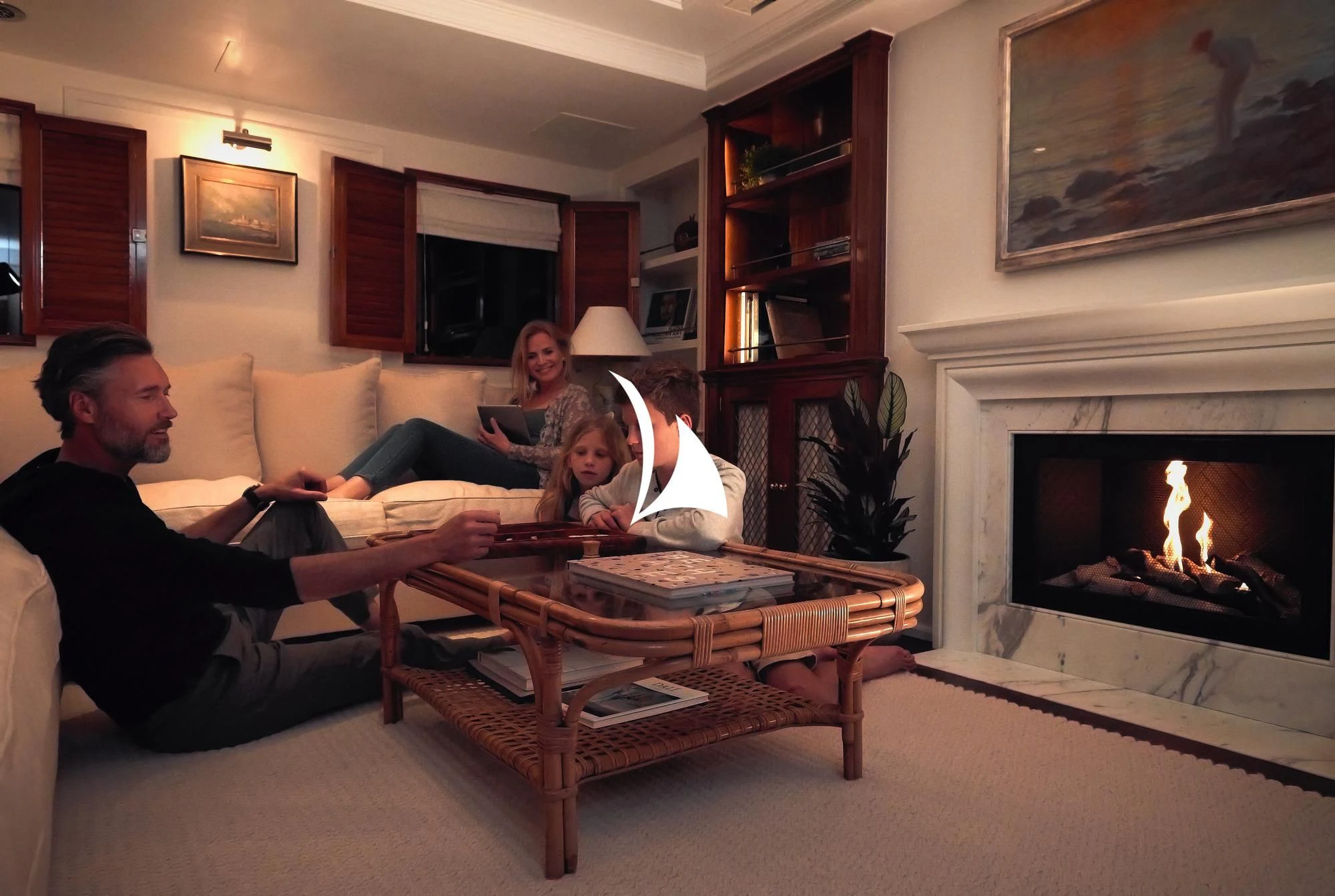 a family sitting around a table aboard HAIDA 1929 Yacht for Sale