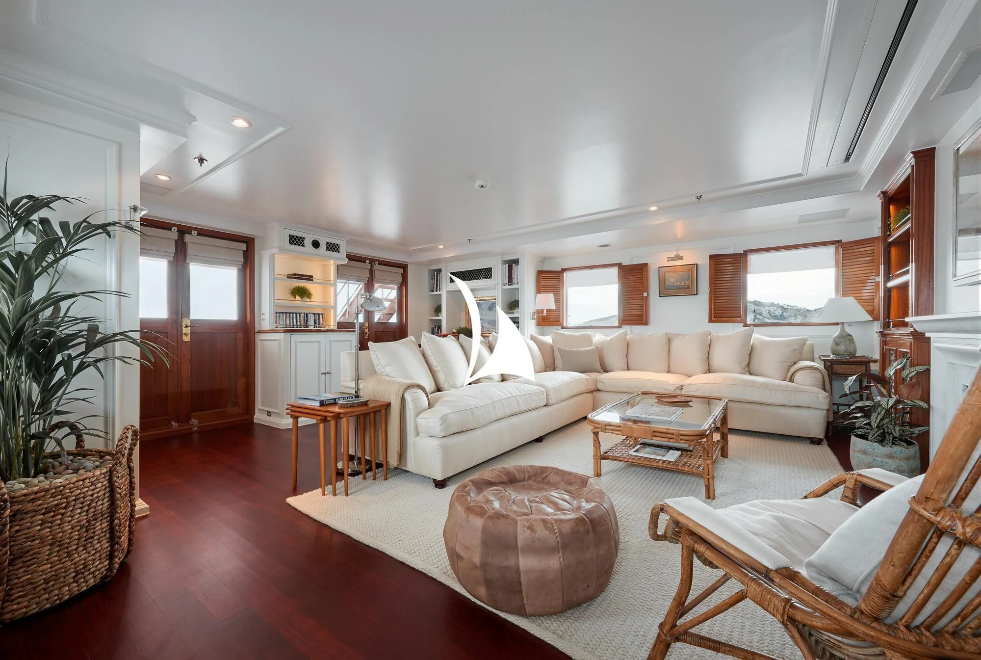a living room with a couch and a coffee table aboard HAIDA 1929 Yacht for Sale