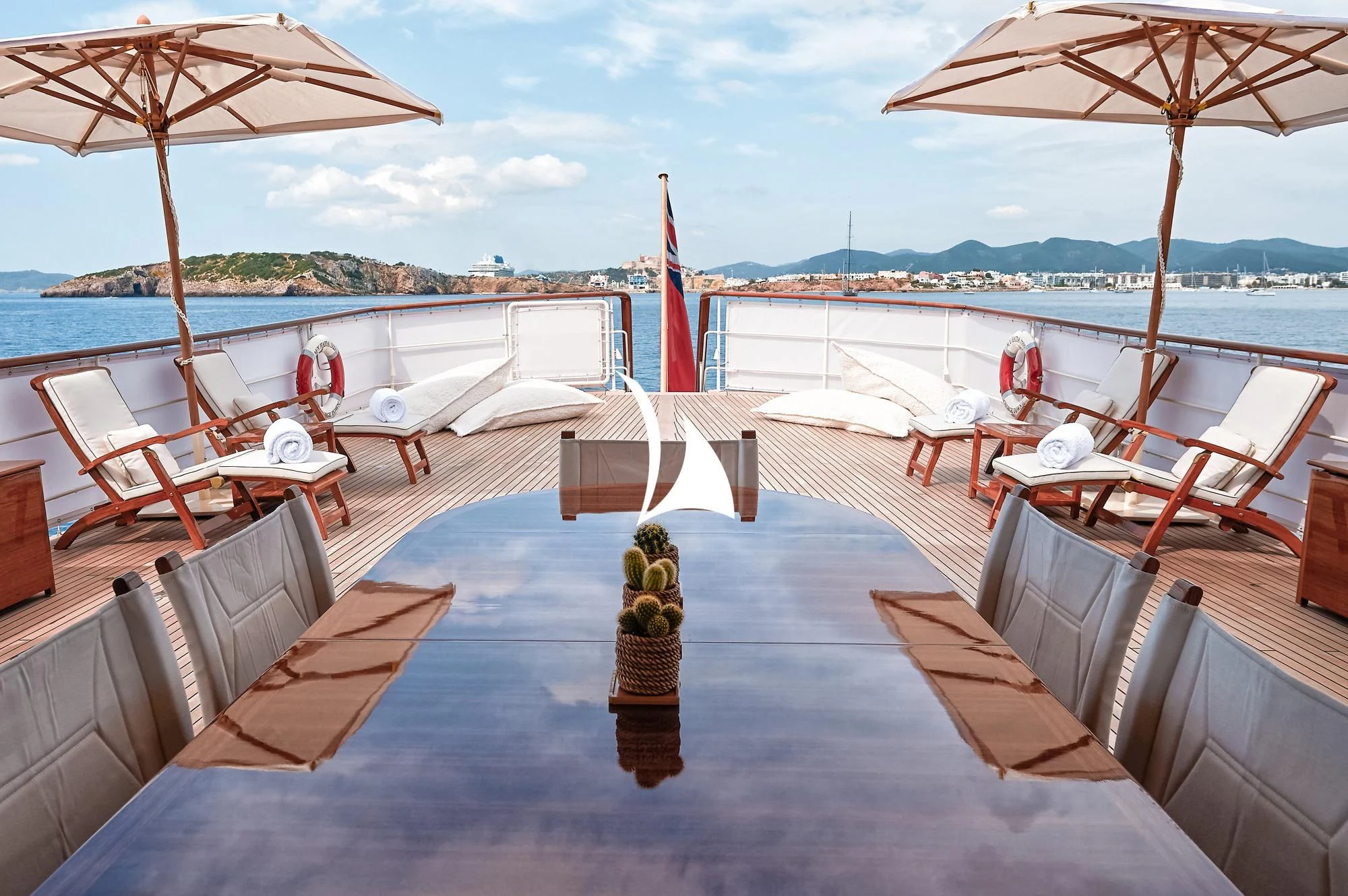 a deck with a large body of water and a statue on it aboard HAIDA 1929 Yacht for Sale