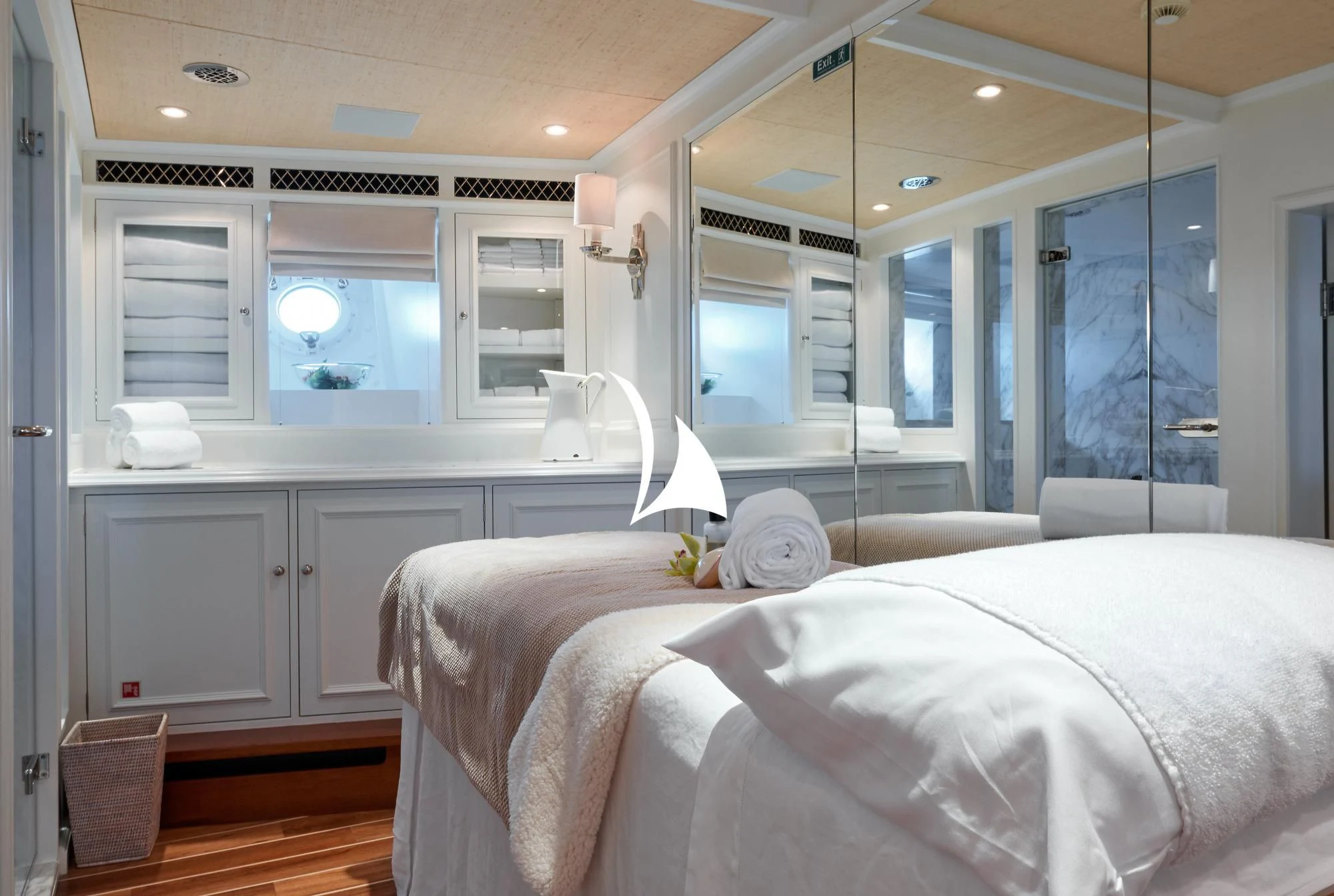 a bedroom with a large bed aboard HAIDA 1929 Yacht for Sale