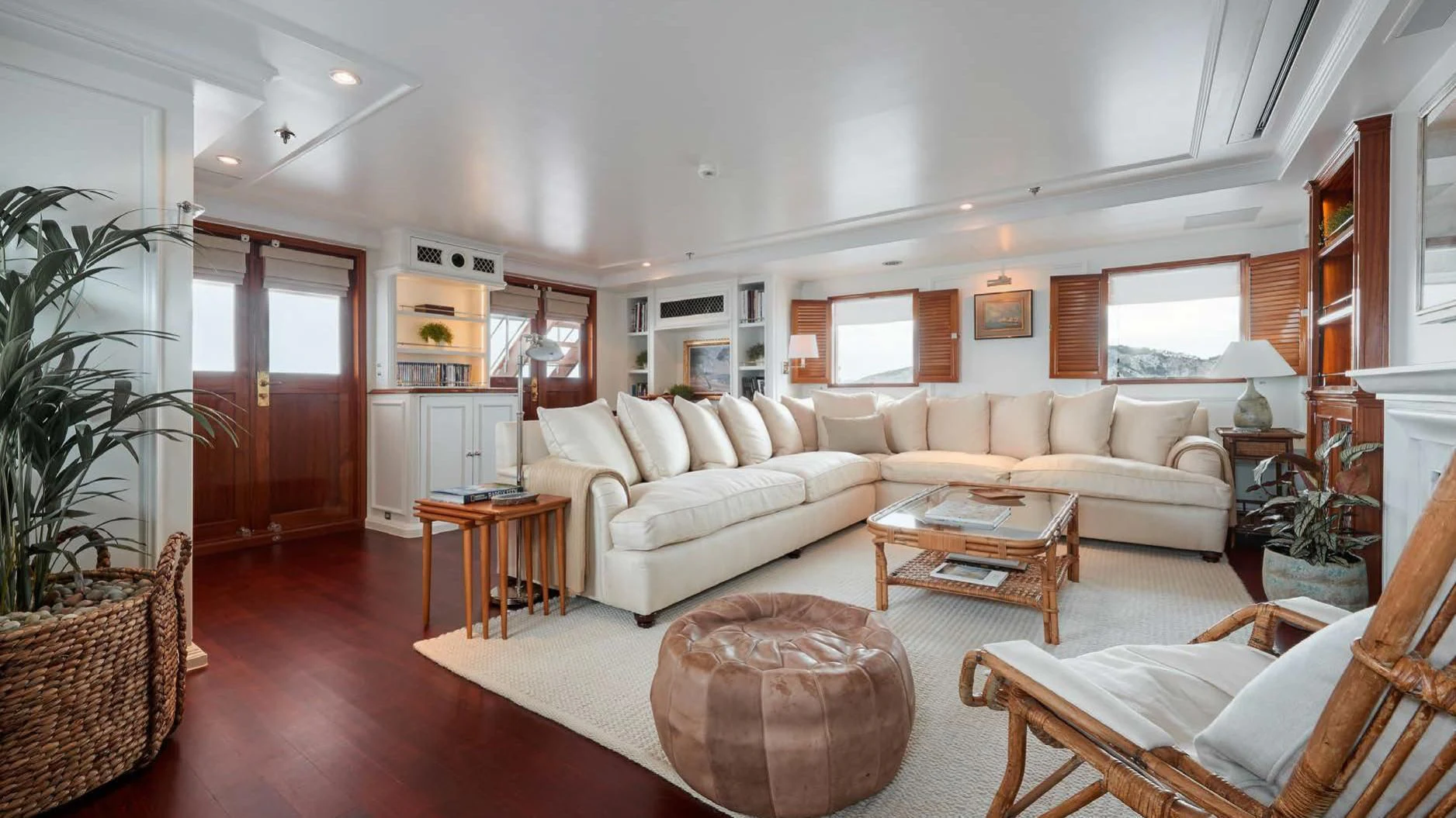 a living room with a couch and a coffee table aboard HAIDA 1929 Yacht for Sale