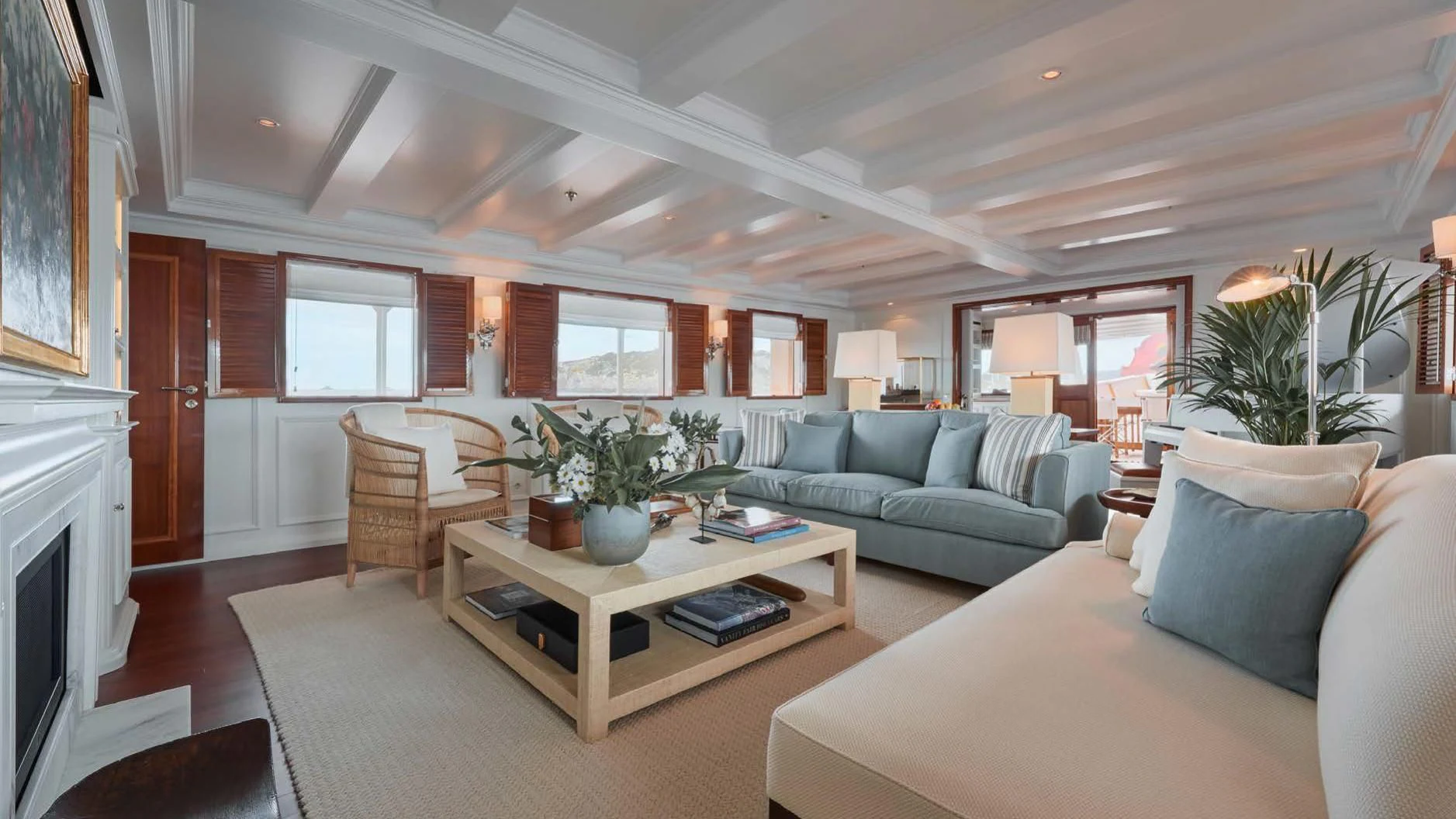 a living room with a couch and a coffee table aboard HAIDA 1929 Yacht for Sale