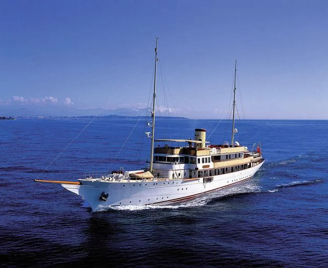 a white boat on the water aboard HAIDA 1929 Yacht for Sale