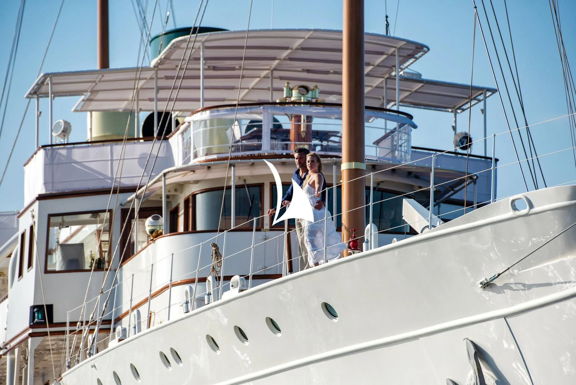a couple of women standing on a boat aboard HAIDA 1929 Yacht for Sale