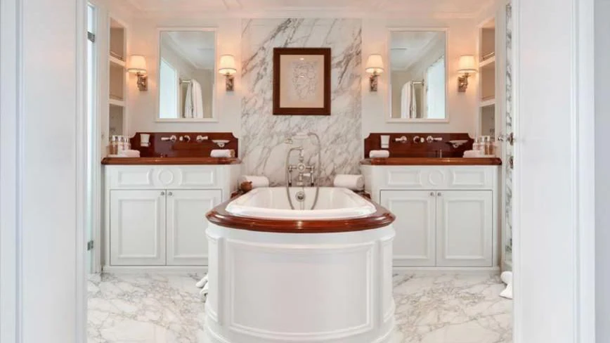 a bathroom with a bathtub and sink aboard HAIDA 1929 Yacht for Sale