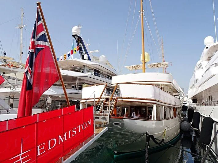 boats docked at a pier aboard HAIDA 1929 Yacht for Sale