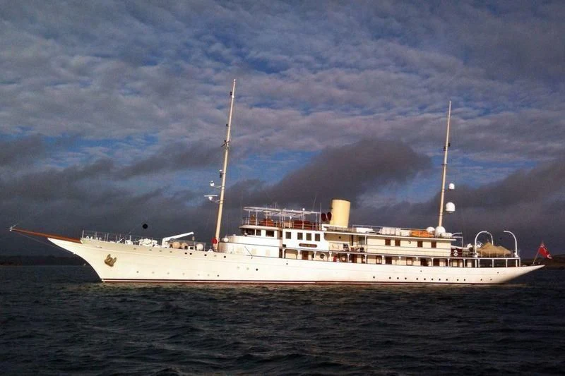 a large white ship in the water aboard HAIDA 1929 Yacht for Sale