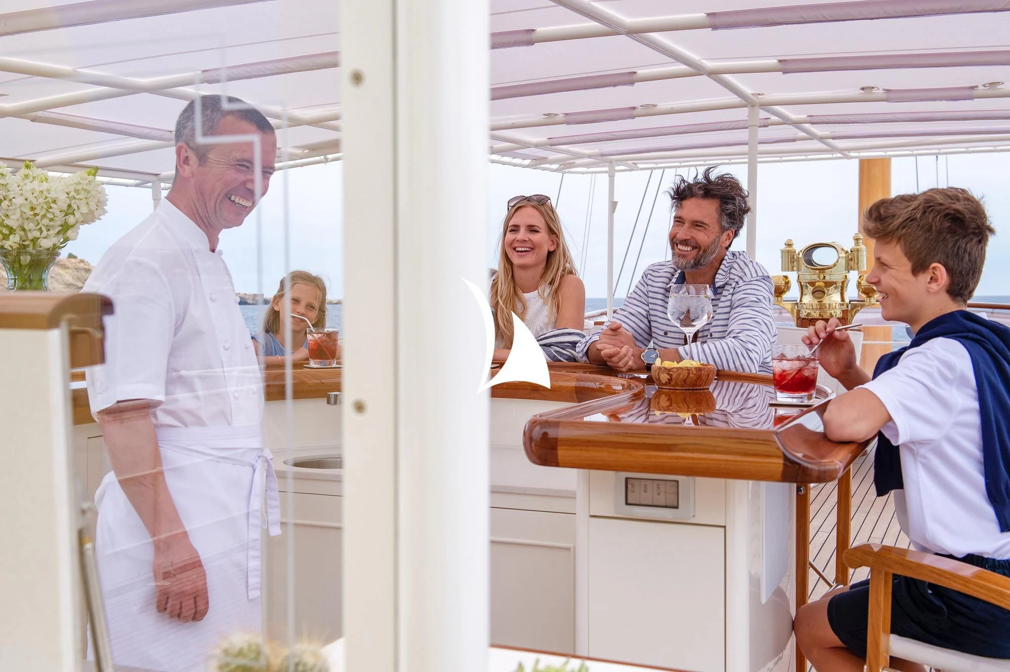 a group of people in a room aboard HAIDA 1929 Yacht for Sale