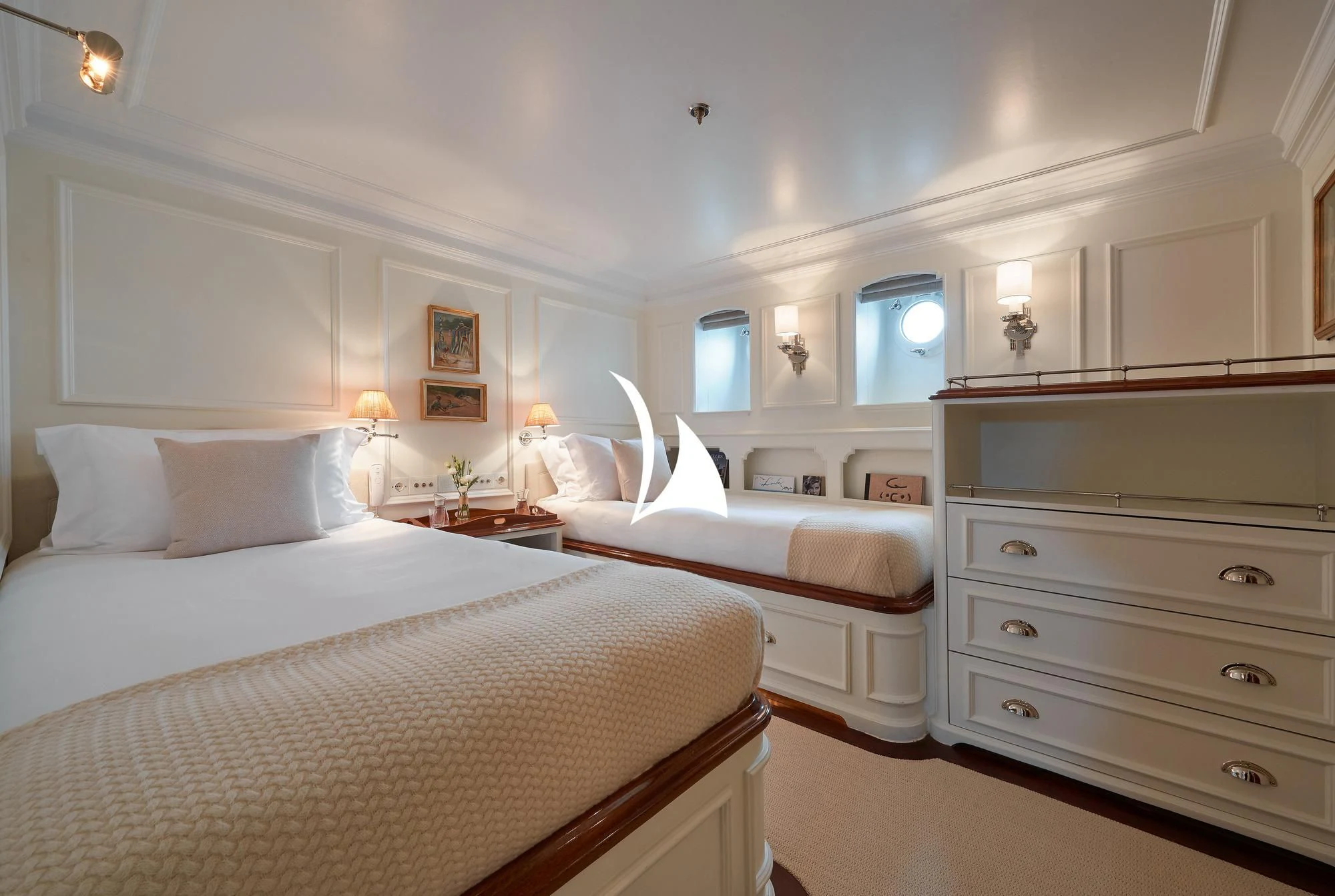 a couple of beds in a hotel room aboard HAIDA 1929 Yacht for Sale