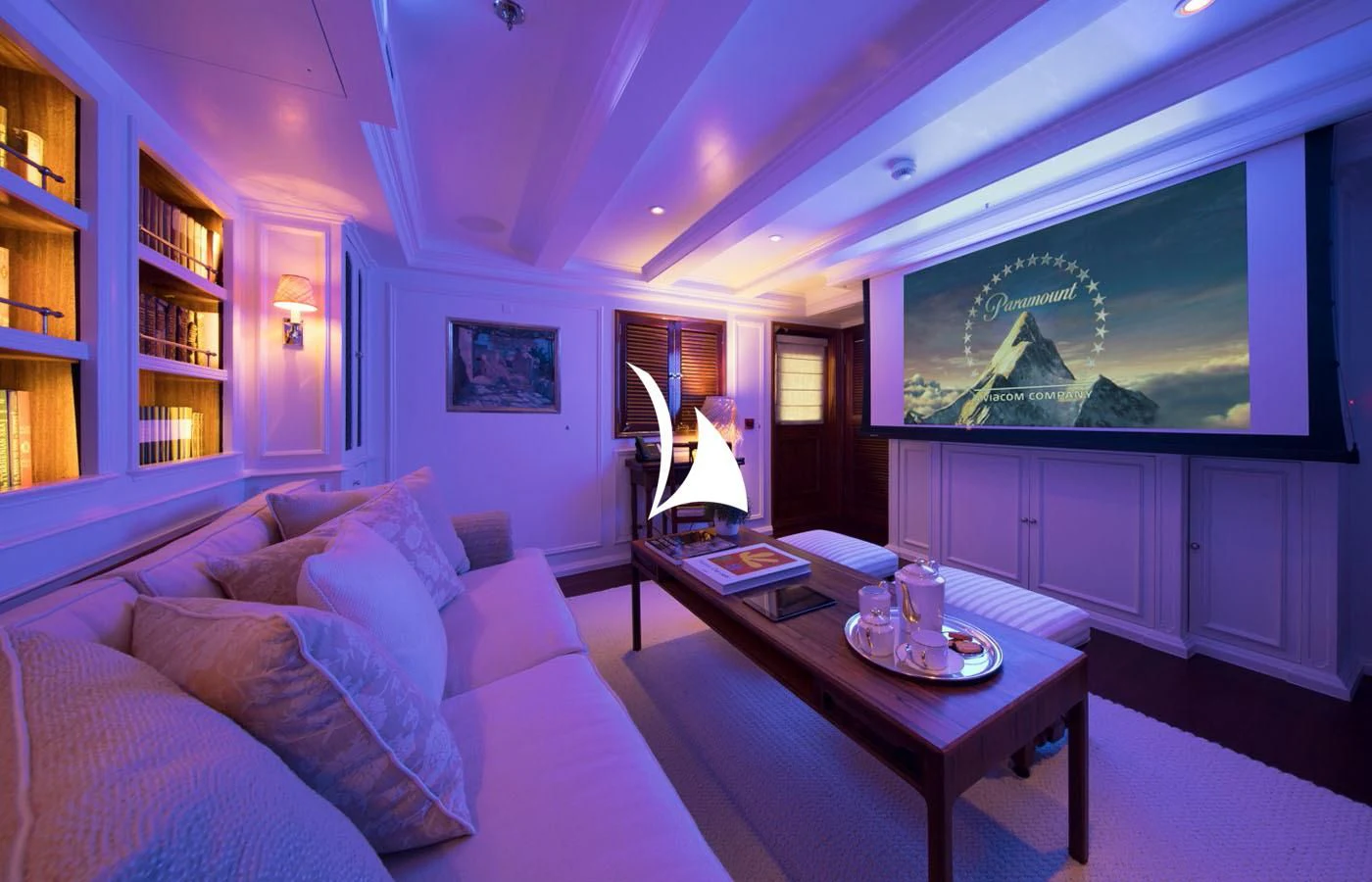 a living room with a couch and a tv aboard HAIDA 1929 Yacht for Sale