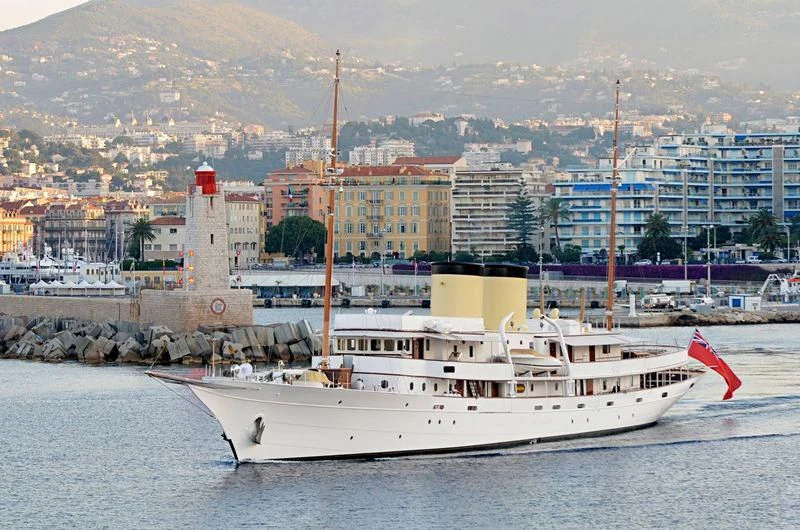 a large white boat in the water aboard HAIDA 1929 Yacht for Sale