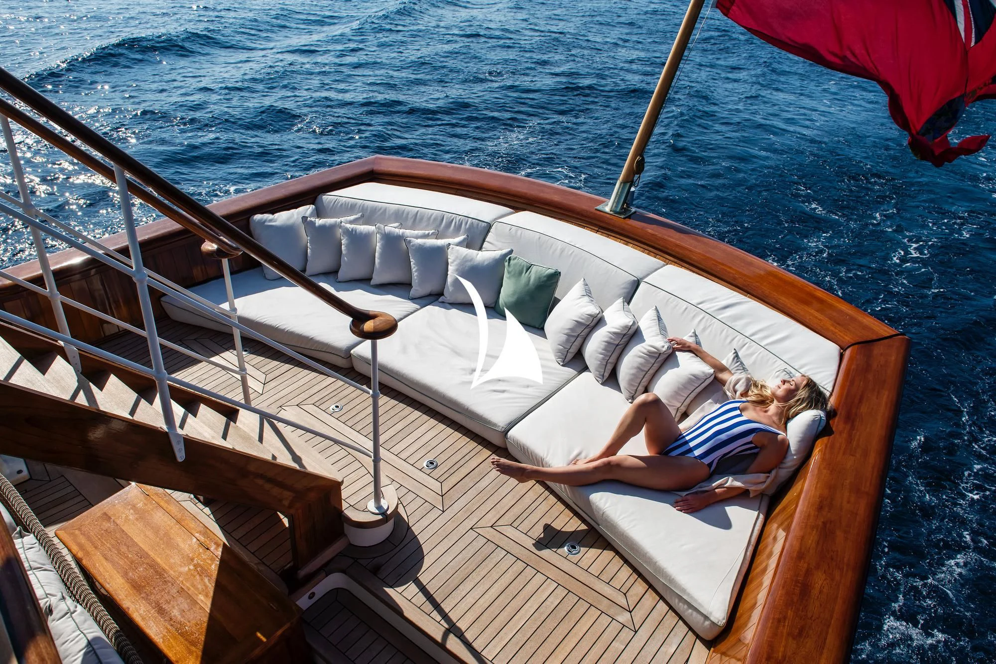 a person lying on a boat aboard HAIDA 1929 Yacht for Sale
