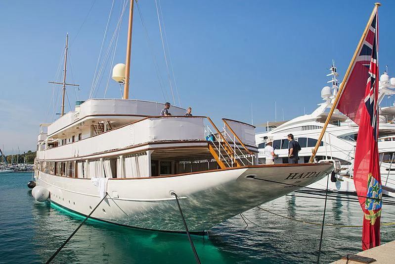 a couple of boats in the water aboard HAIDA 1929 Yacht for Sale