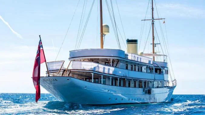 a large boat in the water aboard HAIDA 1929 Yacht for Sale