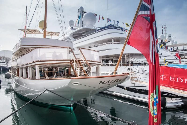 a boat with a red sail aboard HAIDA 1929 Yacht for Sale