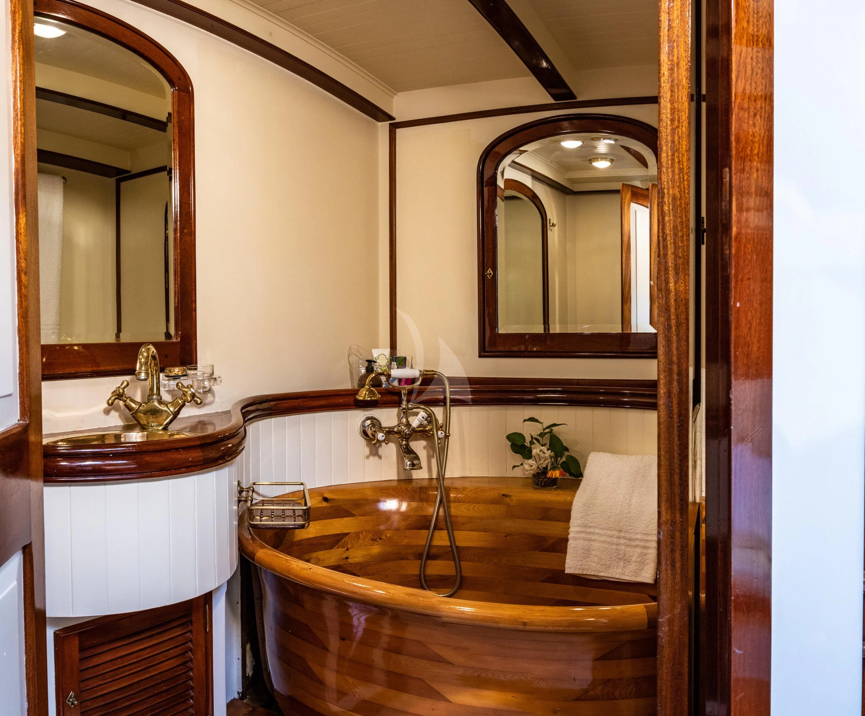 a bathroom with a large mirror aboard WHITEFIN Yacht for Sale