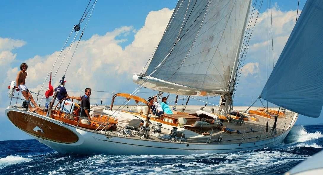 a group of people on a sailboat aboard WHITEFIN Yacht for Sale