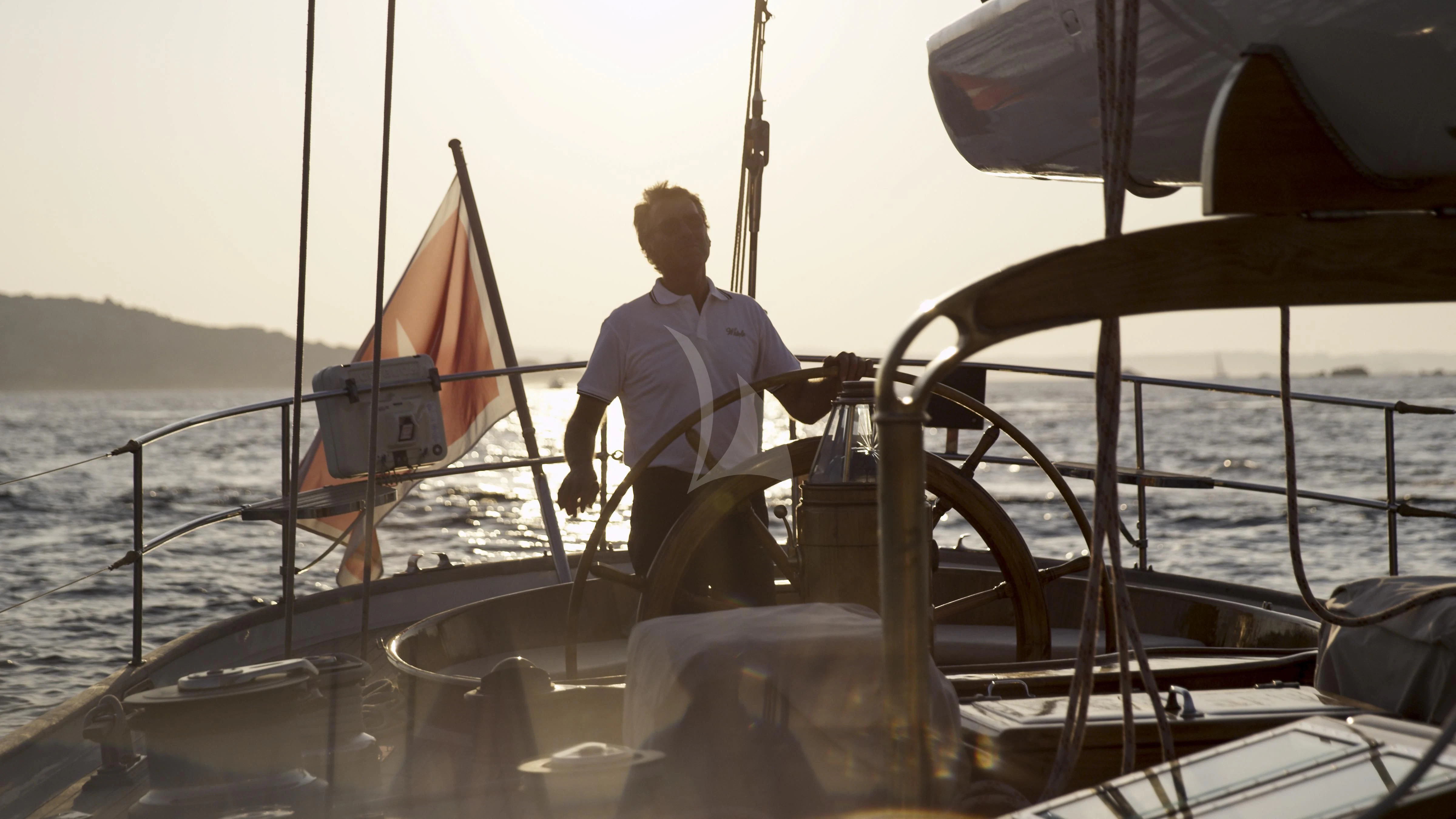 a person on a boat aboard WHITEFIN Yacht for Sale