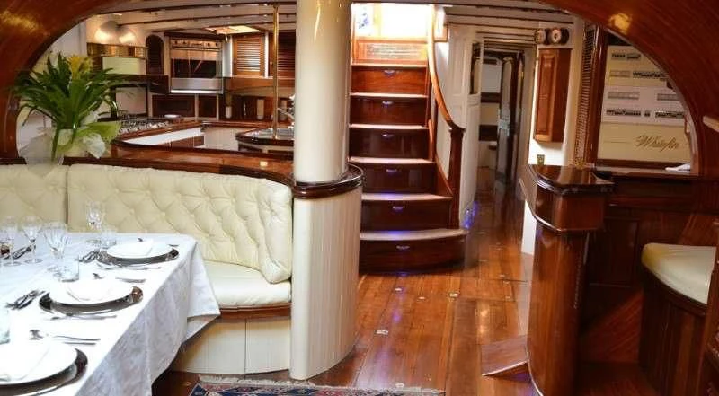 a room with a table and chairs aboard WHITEFIN Yacht for Sale