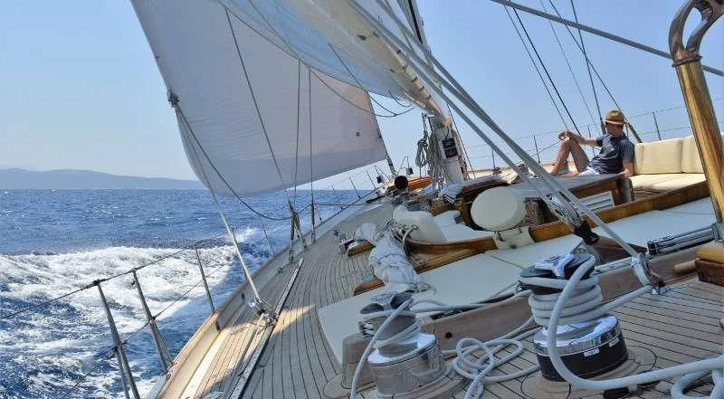 a person on a sailboat aboard WHITEFIN Yacht for Sale