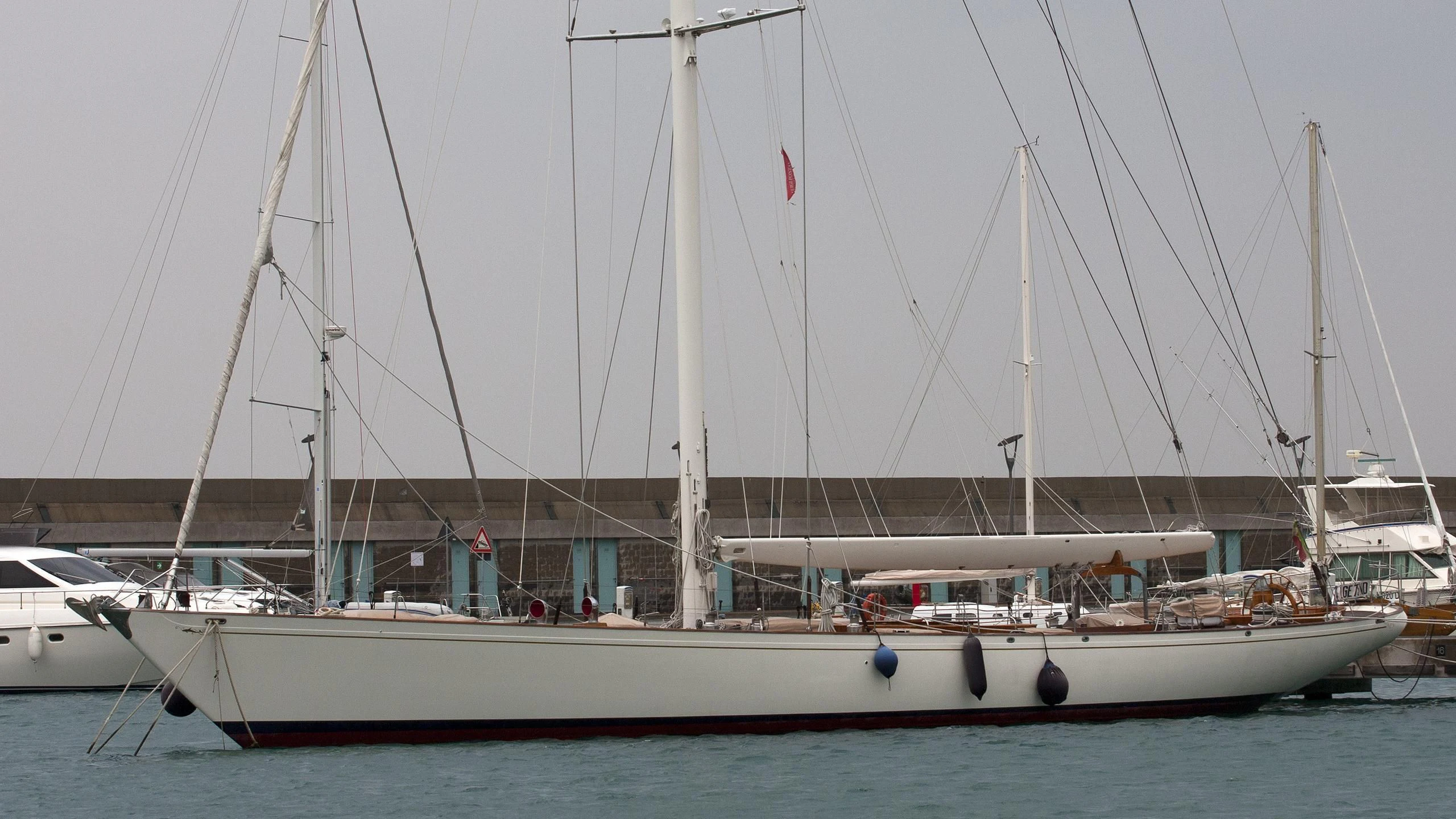 a boat docked at a pier aboard WHITEFIN Yacht for Sale