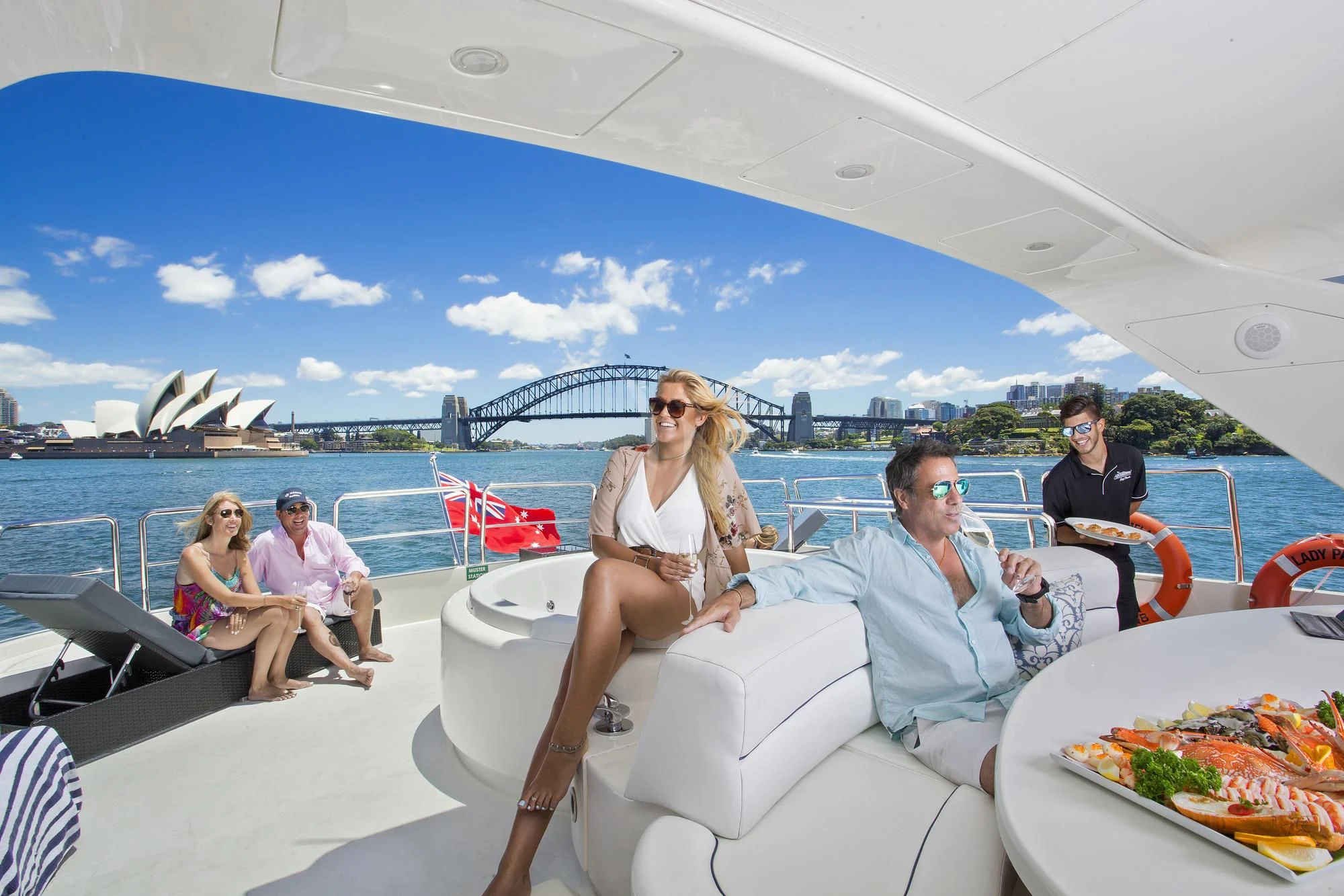 a group of people sitting on a boat aboard LADY PAMELA Yacht for Sale