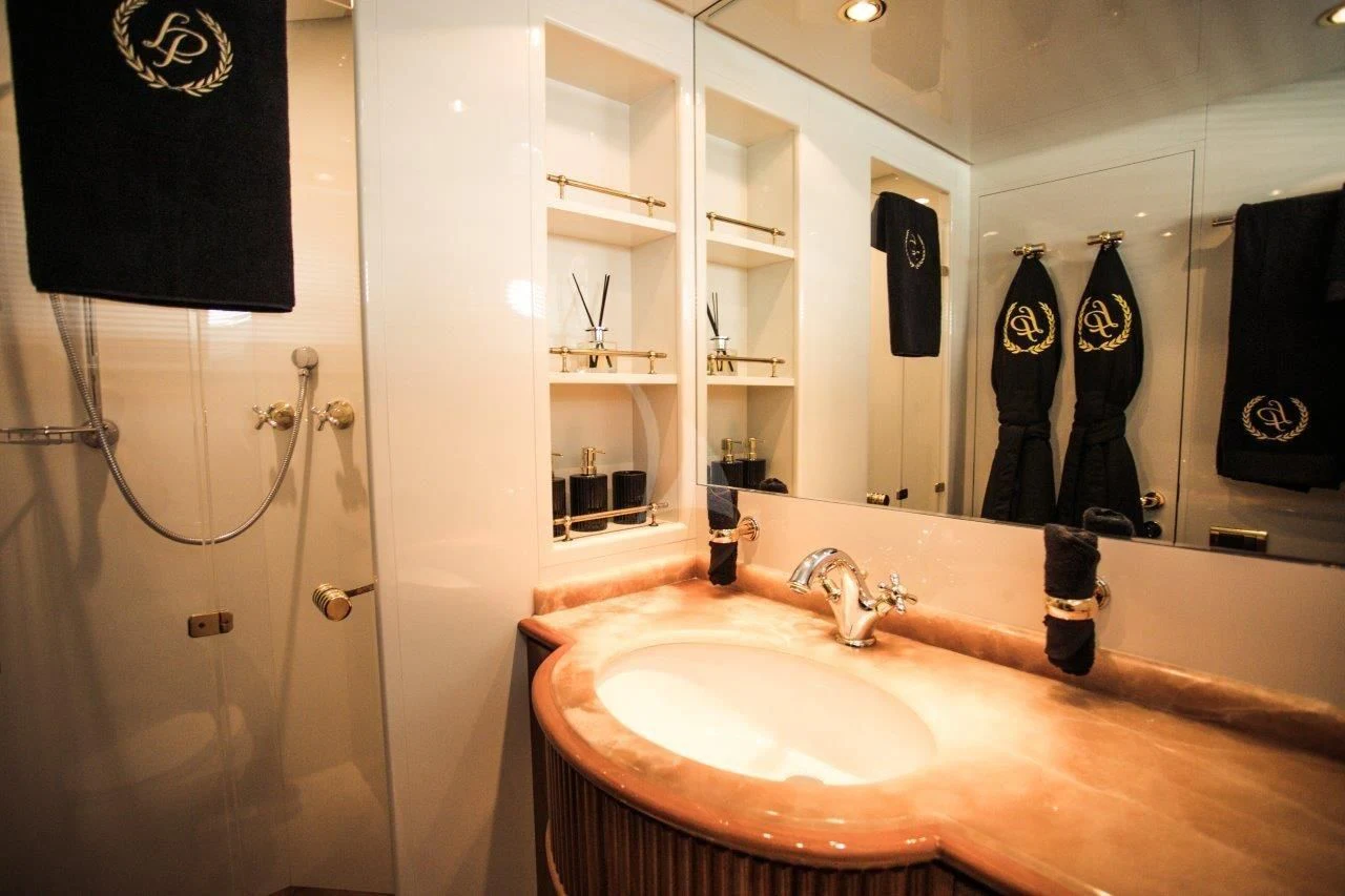 a bathroom with a sink and a mirror aboard LADY PAMELA Yacht for Sale