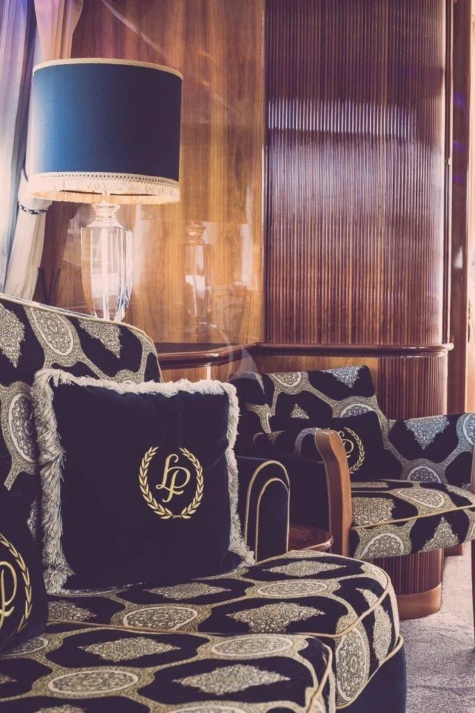 a room with a chair and a lamp aboard LADY PAMELA Yacht for Sale