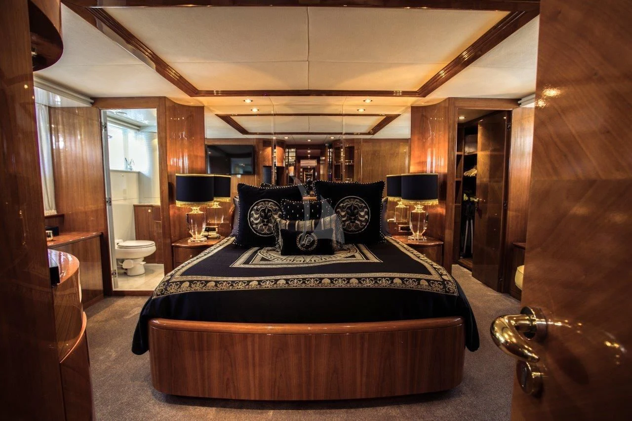 a large bed in a room aboard LADY PAMELA Yacht for Sale