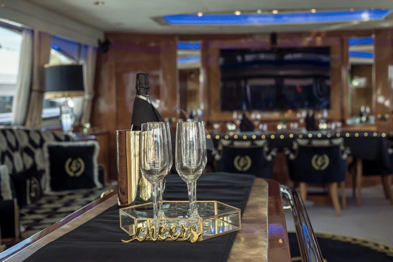 a bar with a statue in the middle aboard LADY PAMELA Yacht for Sale