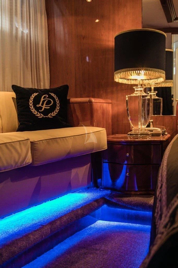a lamp on a couch aboard LADY PAMELA Yacht for Sale