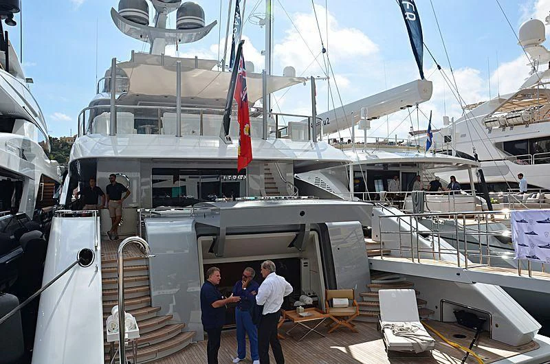 a group of people standing on a boat in the water aboard GALVAS Yacht for Sale