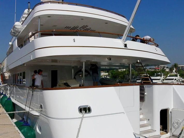 a white boat with people on it aboard LORETTA Yacht for Sale