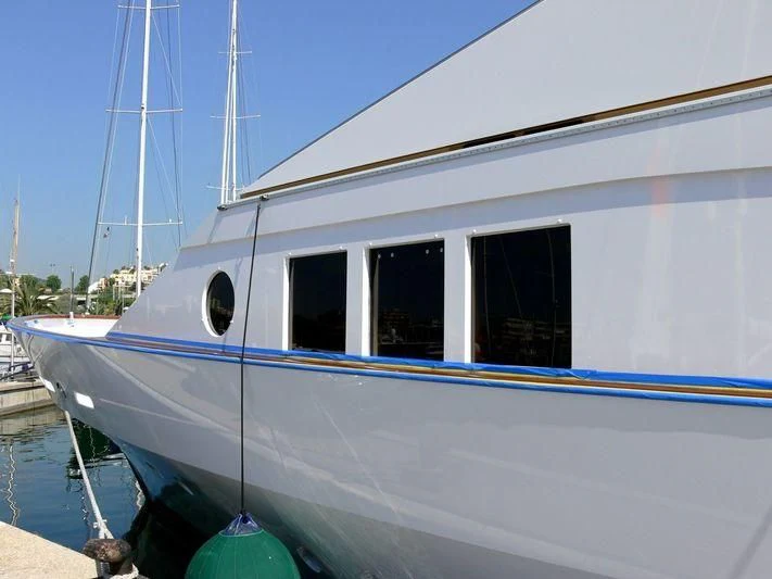 a white boat docked aboard LORETTA Yacht for Sale