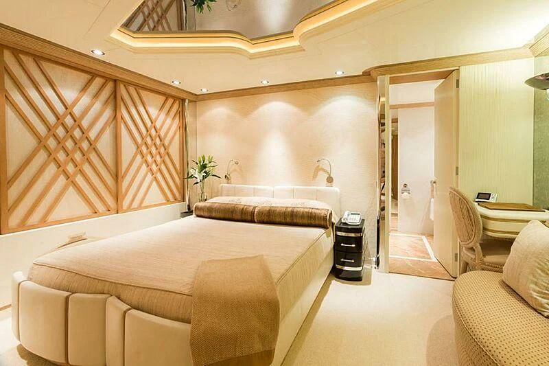a room with a bed and a couch aboard LORETTA Yacht for Sale