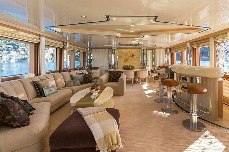 a living room with a couch and a table aboard LORETTA Yacht for Sale