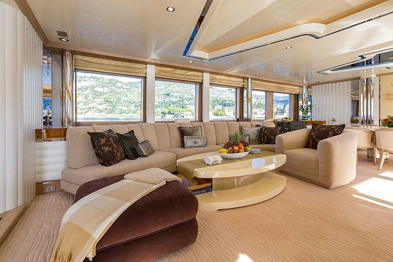 a living room with a couch and a table aboard LORETTA Yacht for Sale