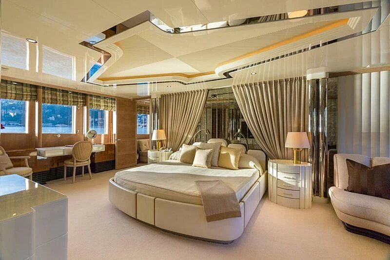 a large bedroom with a large bed aboard LORETTA Yacht for Sale